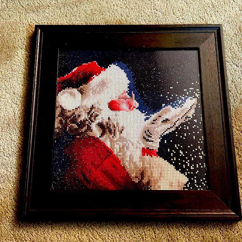 Picture of Santa, with red, white, black and gray with the dark.